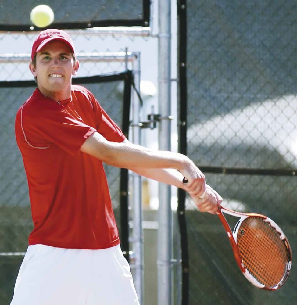 Tennis player Graeme Kassautzki hits a forehand during the Lobos' match against Northern Arizona. The Lobos won 6-1. 