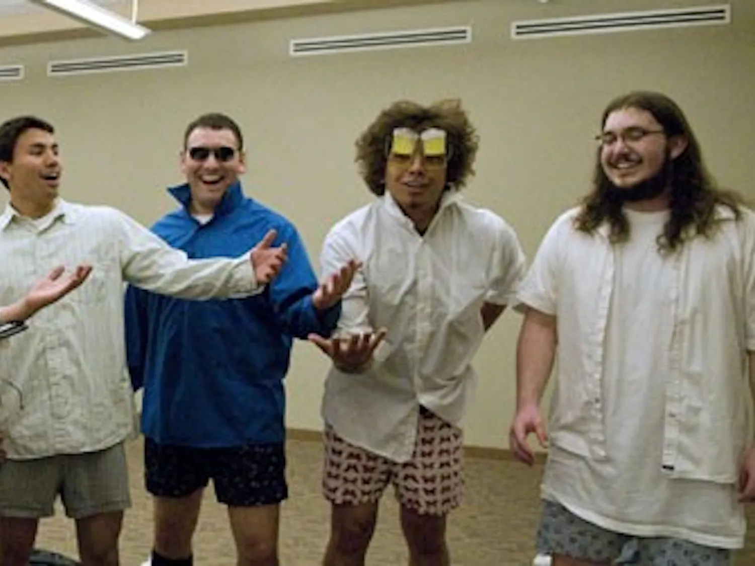 UNM fraternity members practice serenading in the SUB on Monday. Pledges used the power of song to introduce themselves to campus sororities.