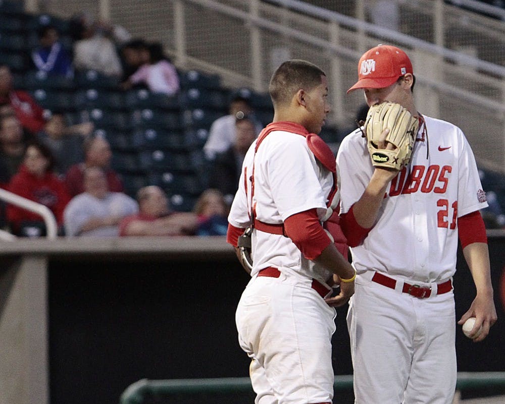 	Catcher Rafael Neda, left, and pitcher Mike Lachapelle talk on the mound during Friday night’s game against BYU at Isotopes Park. The Lobos lost on Friday, 13-5, but won the series closer 10-9 on Saturday.