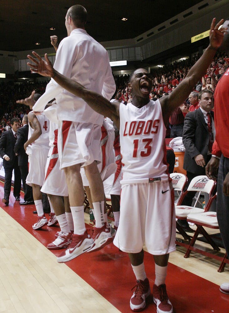 Jamal Fenton raises his arms to a boisterous throng of 13,549.&nbsp;