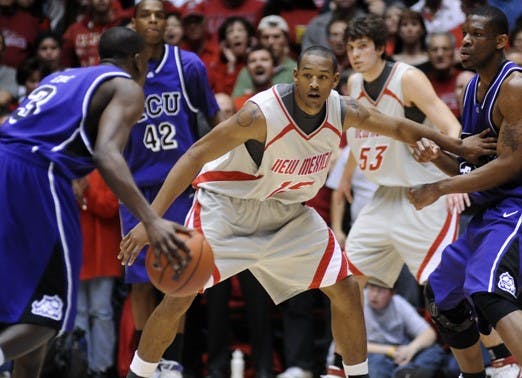 UNM's J.R. Giddens guards TCU's Jason Ebie on Saturday at The Pit. The Lobo defense forced 23 TCU turnovers, turning them into 21 points.