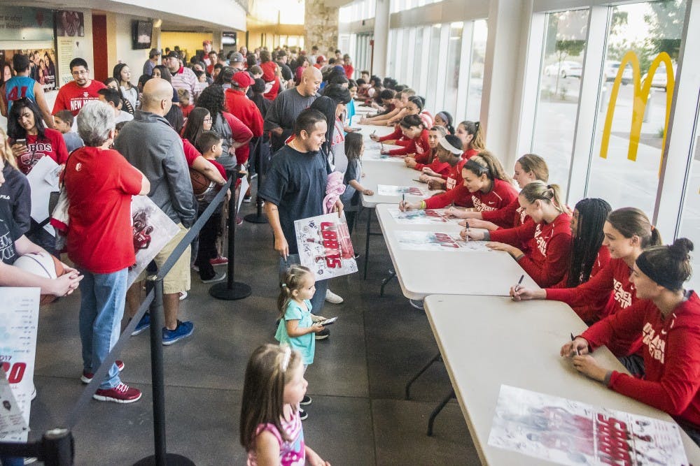 Fans gather to get autographs from the men's and women's basketb