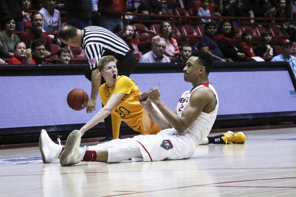 Redshirt junior guard Elijah Brown clinches his fist after a play goes out of bounds Saturday, Jan. 21, 2017 at WisePies Arena. The Lobos will host Boise State Tuesday night.&nbsp;