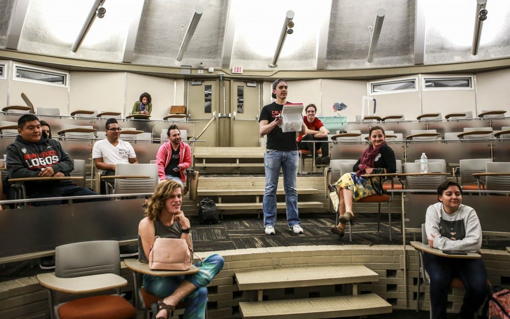 Josh Robbins hands out game sheets for the lottery portion of his “I’m Still Josh” talk at the Kiva Auditorium on Oct. 25, 2017.