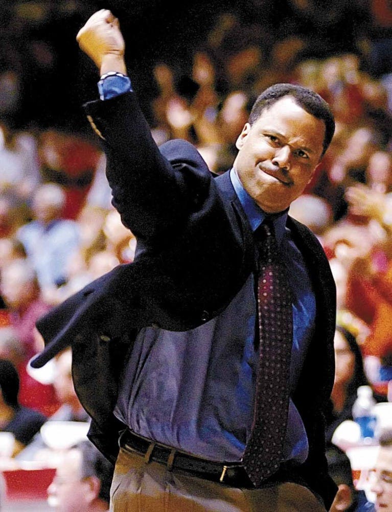 Lobo coach Ritchie McKay pumps his fist as UNM takes a strong lead going into the final minutes of Tuesday's game against Kansas State at The Pit. UNM won 78-54.