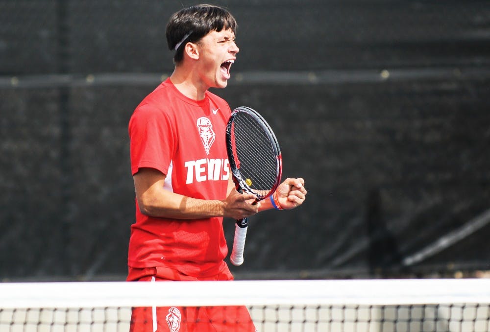 Freshman Ricky Hernandez-Tong celebrates after scoring a point against Air Force Saturday afternoon at the McKinnon Family Tennis Stadium. The Lobos swept both BYU and Air Force this past weekend in Albuquerque.