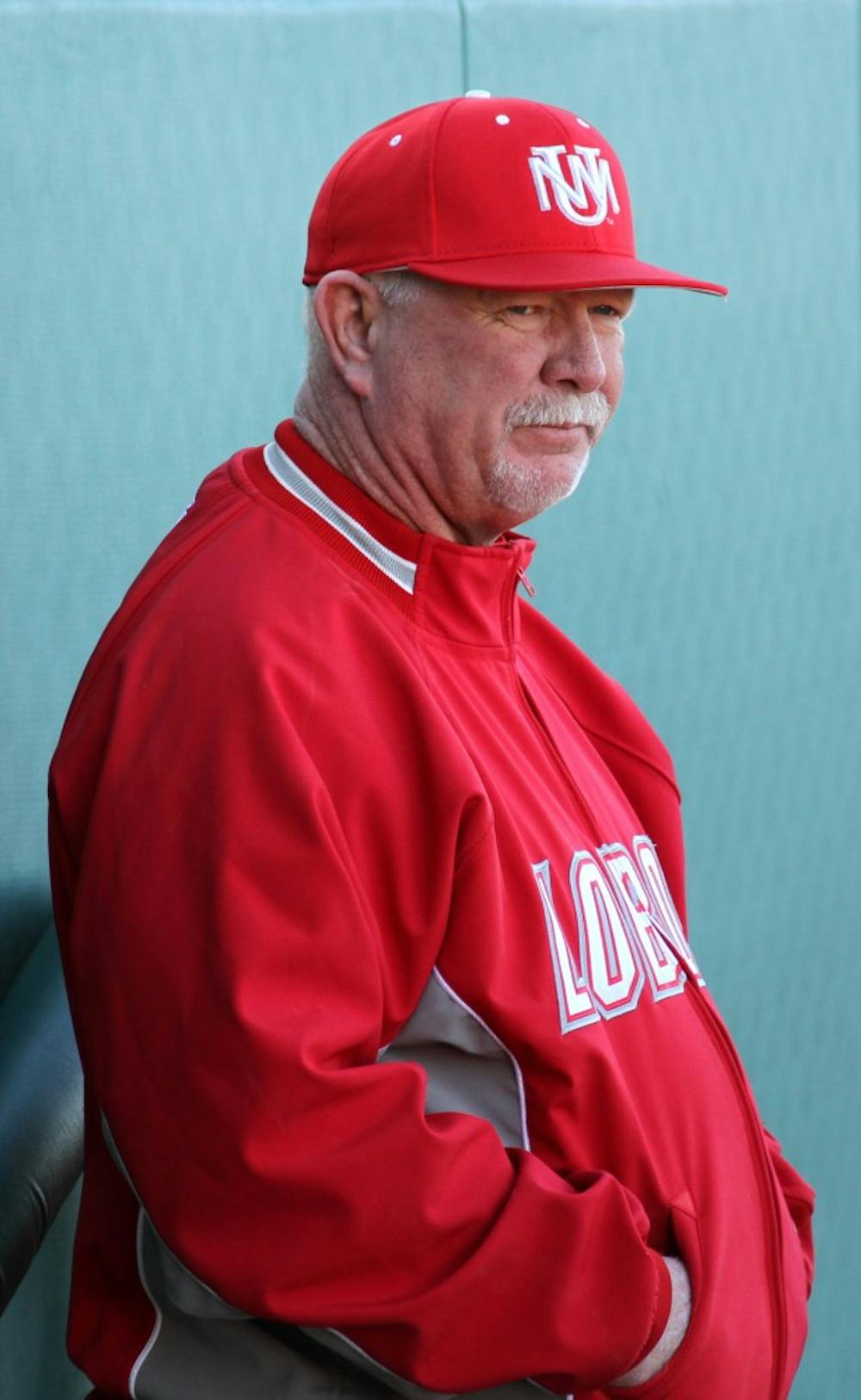 	UNM head coach Ray Birmingham watches his team from the dugout on Feb. 21. Birmingham has built four baseball programs across the state. 