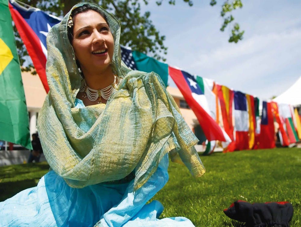 Dance instructor Mala Maten stretches before performing kathak, an eastern Indian dance, at the International Festival in front of the SUB on Thursday. 