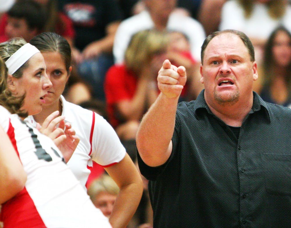 	Volleyball head coach Je Nelson shouts instructions to one of his players during the Lobos’ game against Stanford on Sunday. The Lobos lost all three sets.