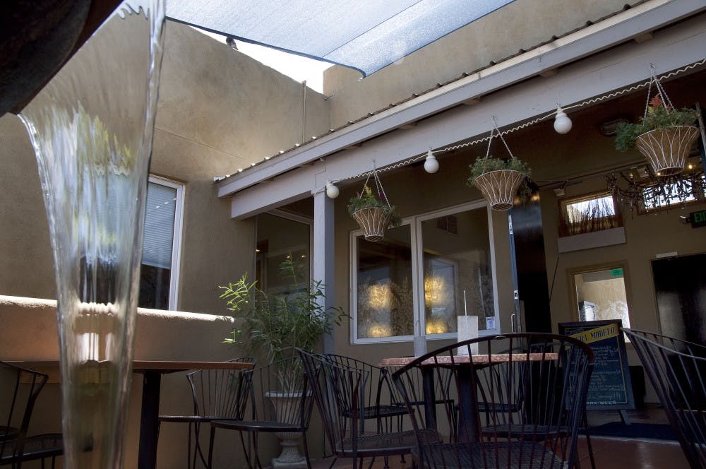 	A view of the courtyard of Cosmo Tapas at 4200 Central Ave. as seen Saturday. Cosmo Tapas opened July 13.