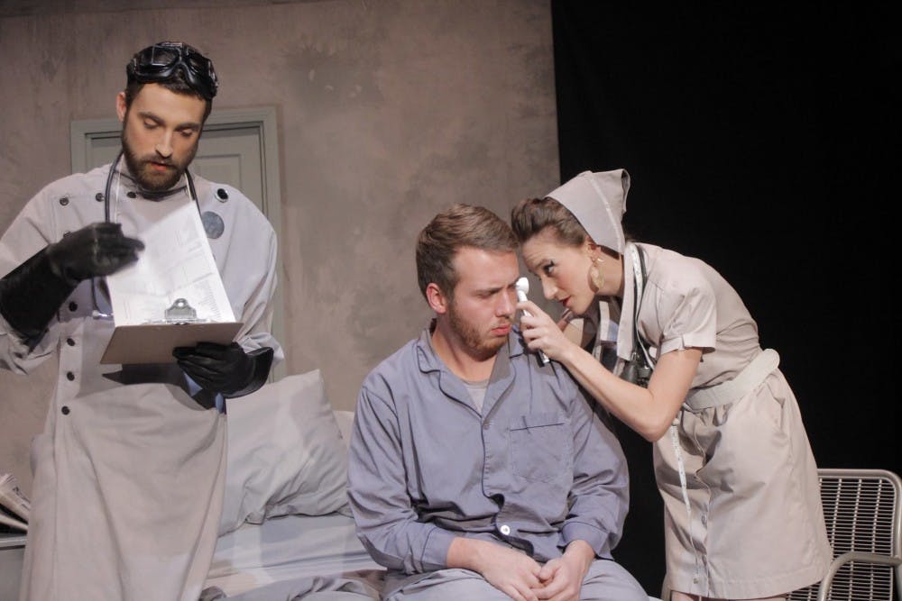 William Dole (center) acts in a play titled The Day Room.