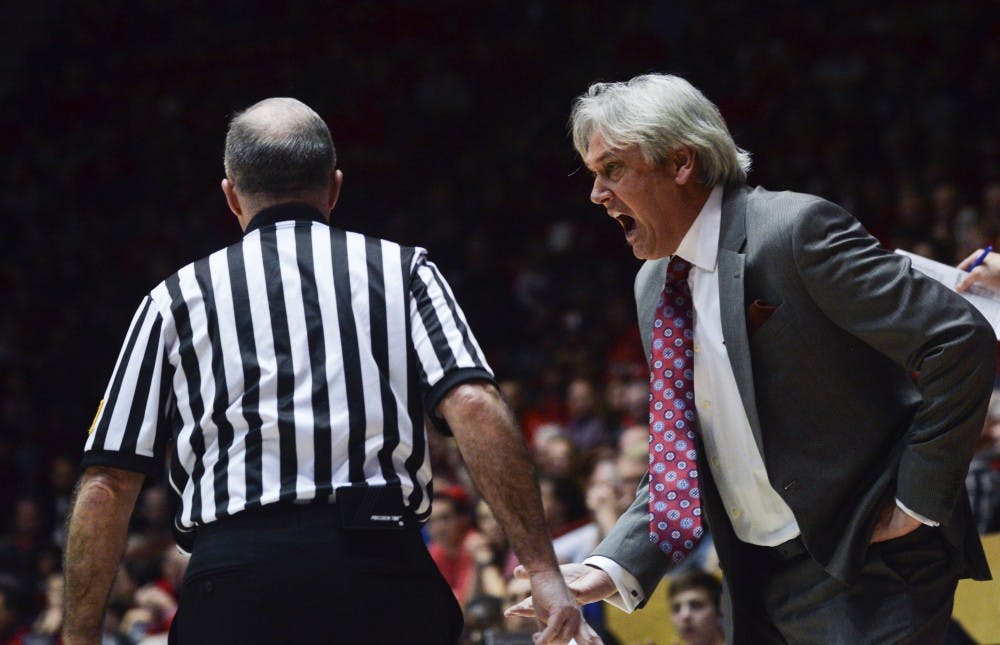Head coach Craig Neal exchanges words with referee Bob Staffen after Staffen called a fawl against New Mexico Saturday afternoon at WisePies Arena. The Lobos lost to Wyoming 70-68.
