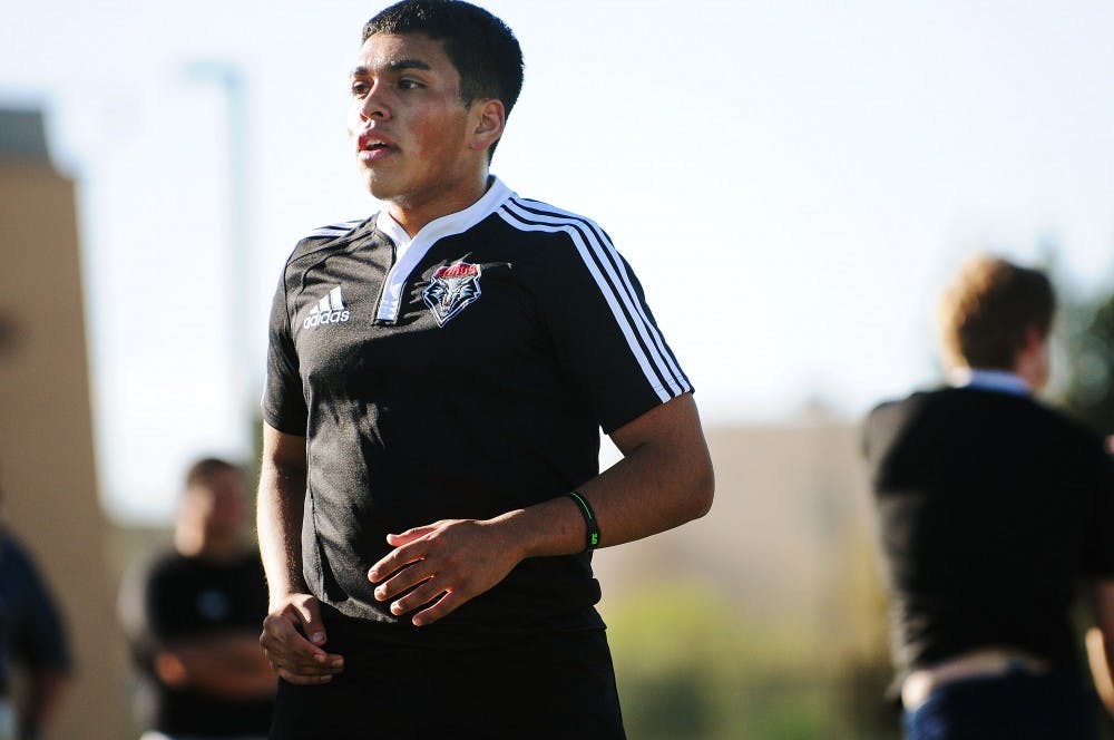	Alex Melad takes a breather during the UNM rugby team’s practice at Johnson Field on Wednesday. Melad said the club will lose a large portion of the team by the end of the semester and is recruiting members.