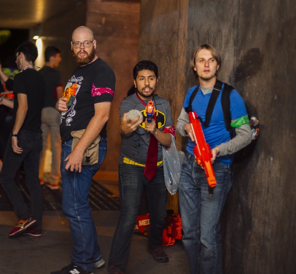 Participants of the week-long Humans vs. Zombies game stand in the Center of the Universe with NERF guns Tuesday, Oct. 25, 2016. Groups of players act as humans and zombies and play a campus-wide game of tag.&nbsp;