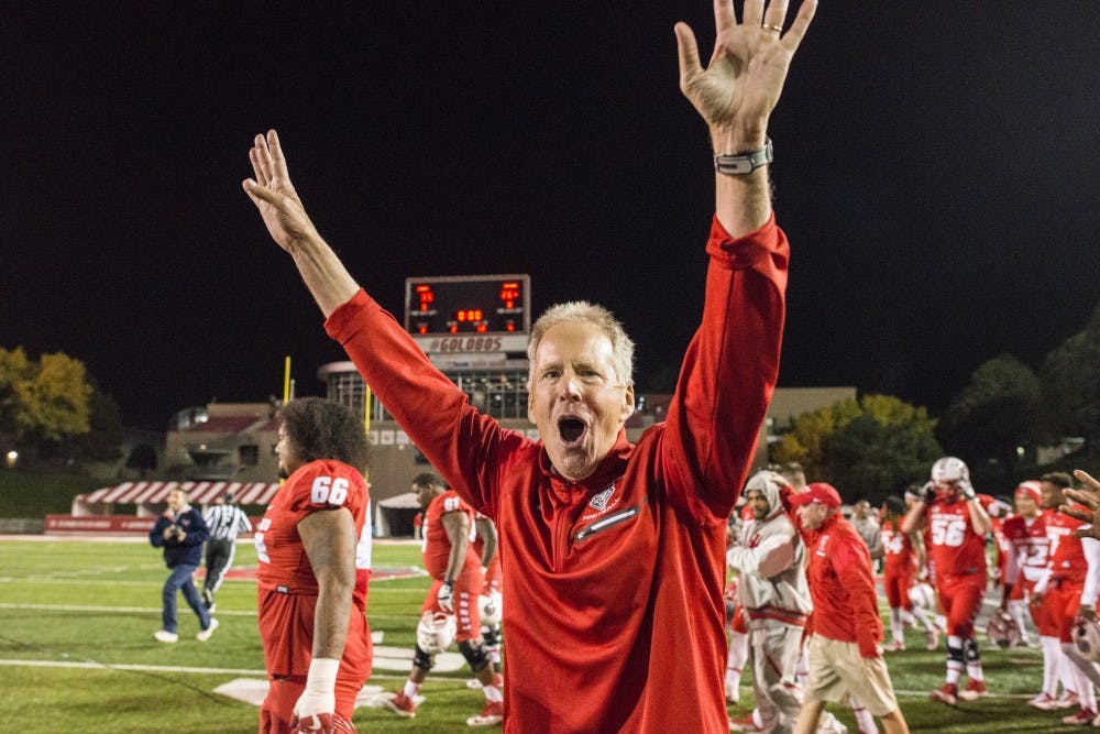 New Mexico Head Coach celebrates bowl eligiblity after defeating the Nevada Wolfpack 35-26 at Branch Field at University Stadium early Sunday morning 
