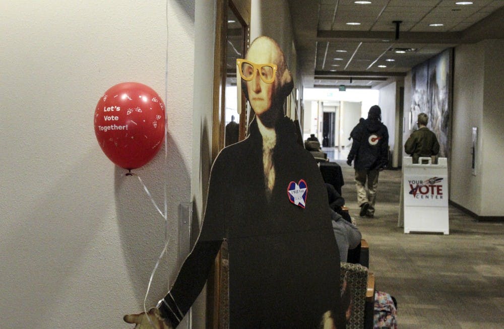 A cutout of George Washington welcomes party goers to the MitzVote voting party held by UNM Hallel Thursday, Nov. 3 in the UNM student union building.
