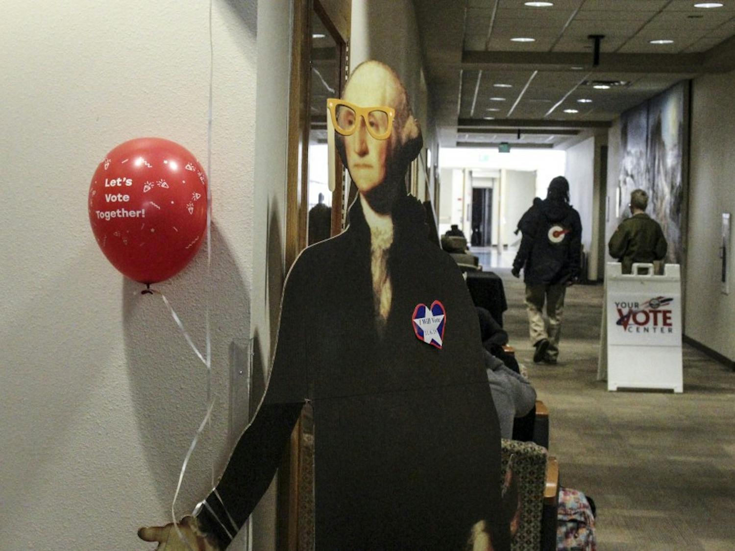 A cutout of George Washington welcomes party goers to the MitzVote voting party held by UNM Hallel Thursday, Nov. 3 in the UNM student union building.
