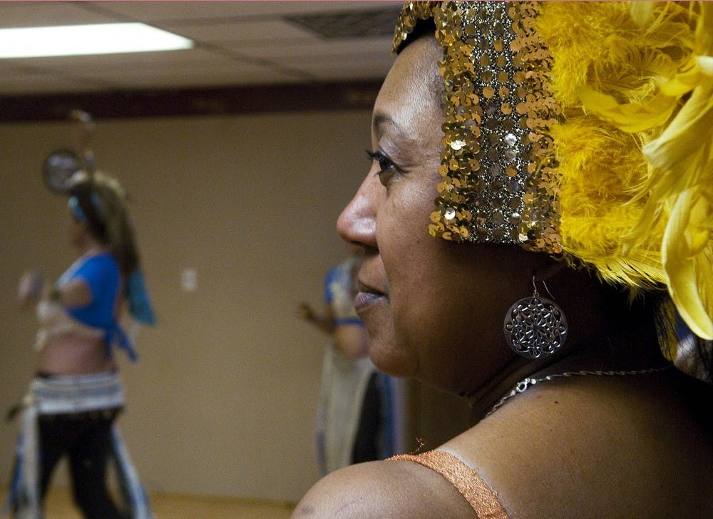 	Evon Harrison rehearses a samba piece in preparation for East Meets West at Farfesha Belly Dance Studios on Monday. The show begins at 7:30 p.m. on Friday and Saturday at the Filling Station.