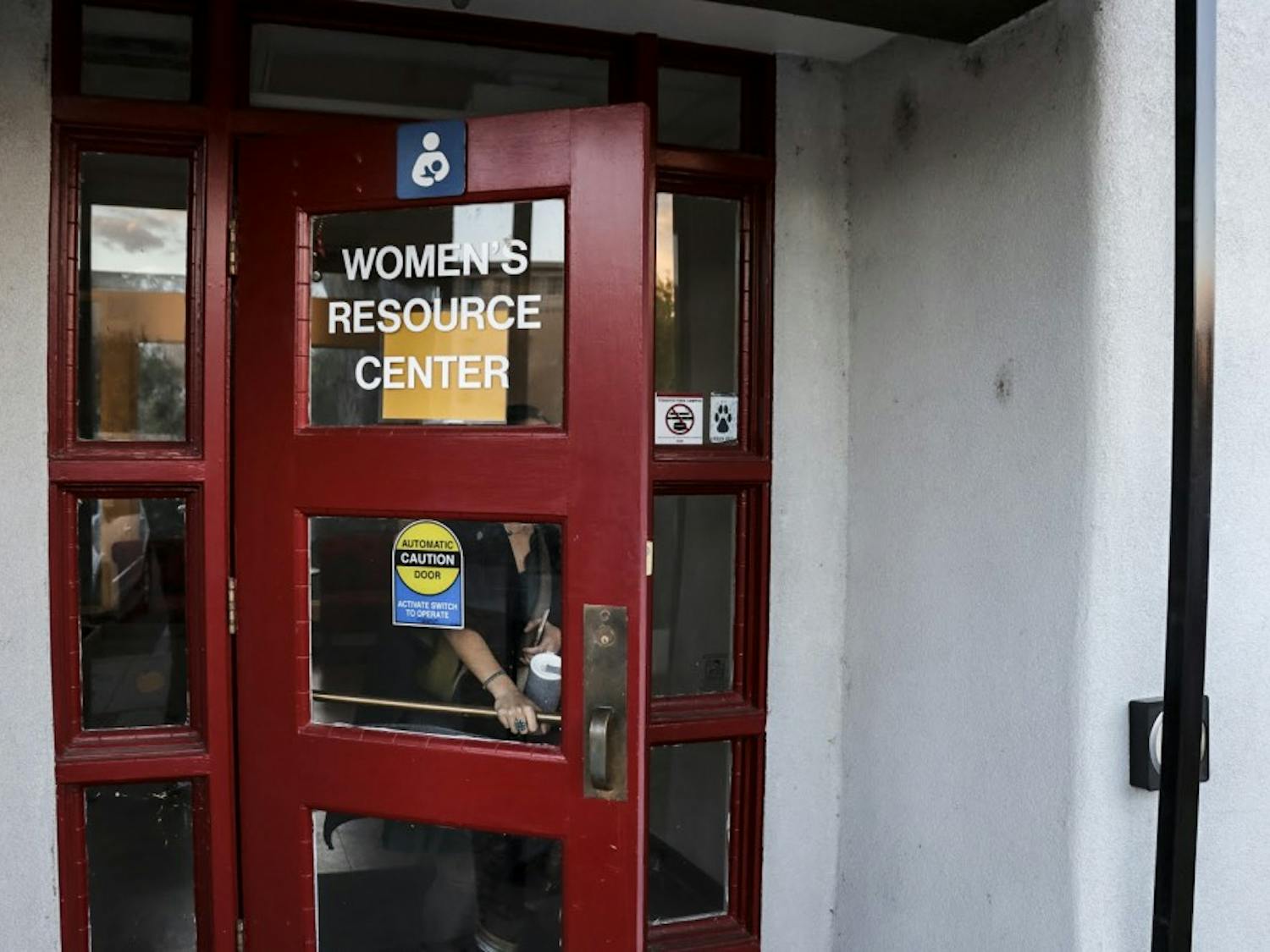 A woman walks out of the Women's Resource Center on the evening of Oct. 24, 2018.