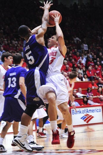 Phillip McDonald shoots over TCU's Ronnie Moss during UNM's 76-62 win at The Pit.