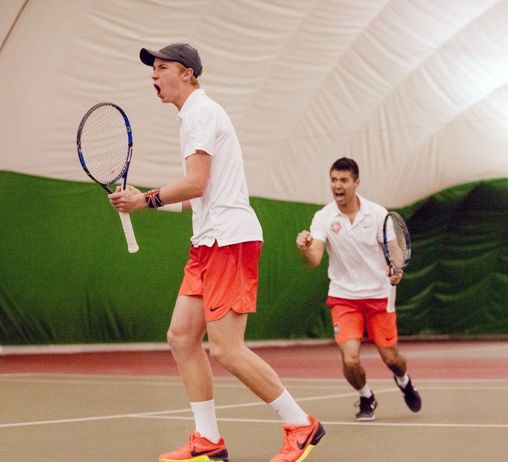 Dominic West and Jorge Escutia celebrate game point against NMSU on Feb 25th