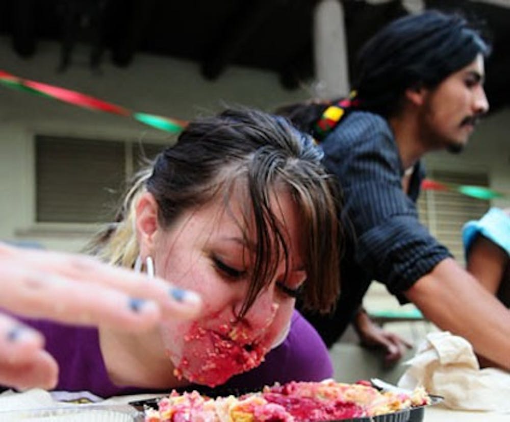 Student Nayra Gallegos competes in a pie-eating contest during a Cinco de Mayo celebration Monday at Mesa Vista courtyard. Cinco de Mayo commemorates Mexico's victory over French forces in the Battle of Puebla in 1862.