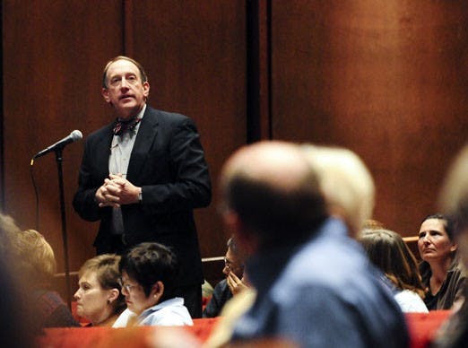 John Taylor addresses fellow faculty members about one of the ballot items presented at their meeting on Wednesday at Popejoy Hall. 