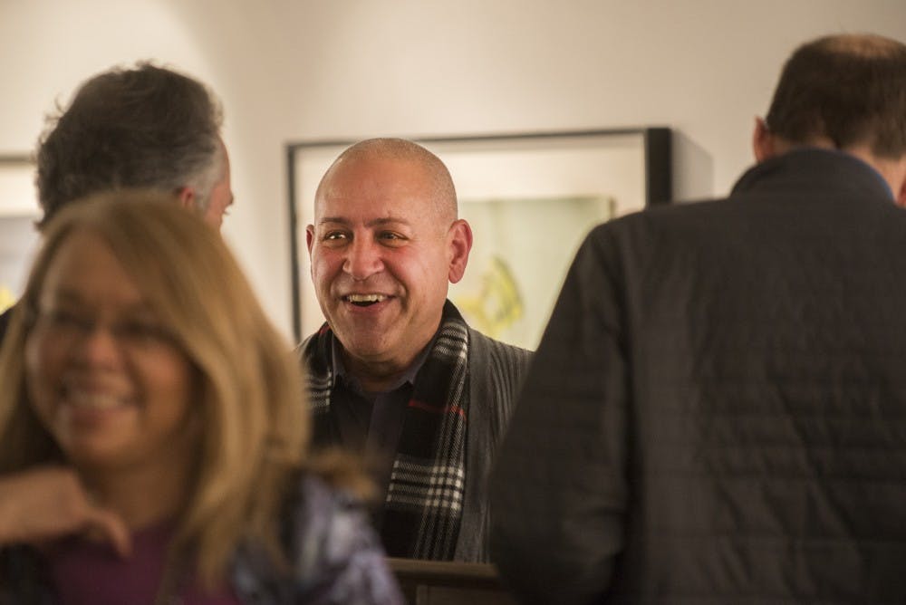 Omar Diaz Liria speaks with attendees after his Cuban art discussion Tuesday, Feb. 9, 2016 at the Tamarind Gallery. Diaz spoke about the evolving artistic and cultural changes Cuba has gone through.