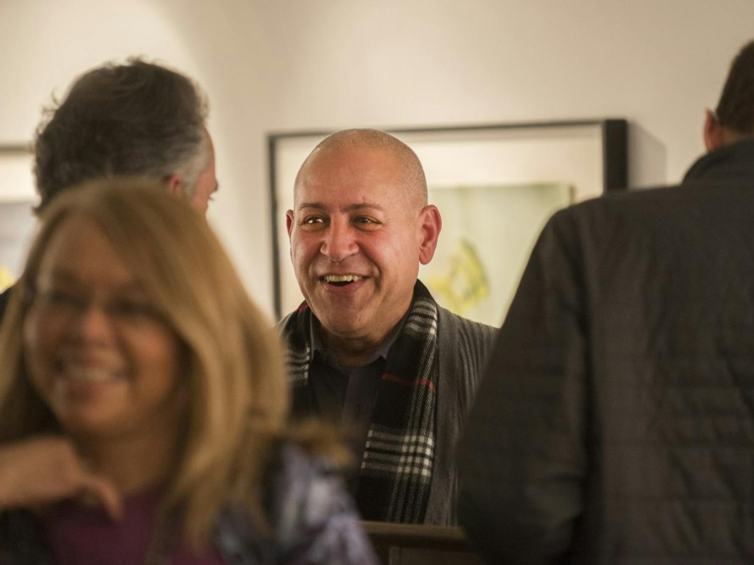 Omar Diaz Liria speaks with attendees after his Cuban art discussion Tuesday, Feb. 9, 2016 at the Tamarind Gallery. Diaz spoke about the evolving artistic and cultural changes Cuba has gone through.