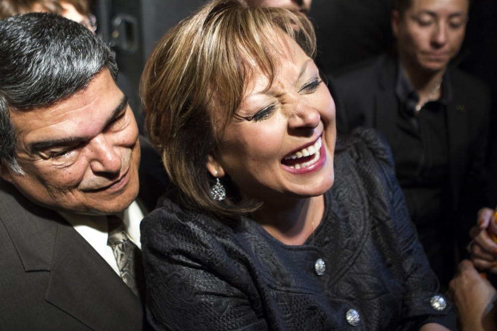 Governor Susana Martinez leaves the stage and celebrates winning her 2014 election Nov. 4, 2014.