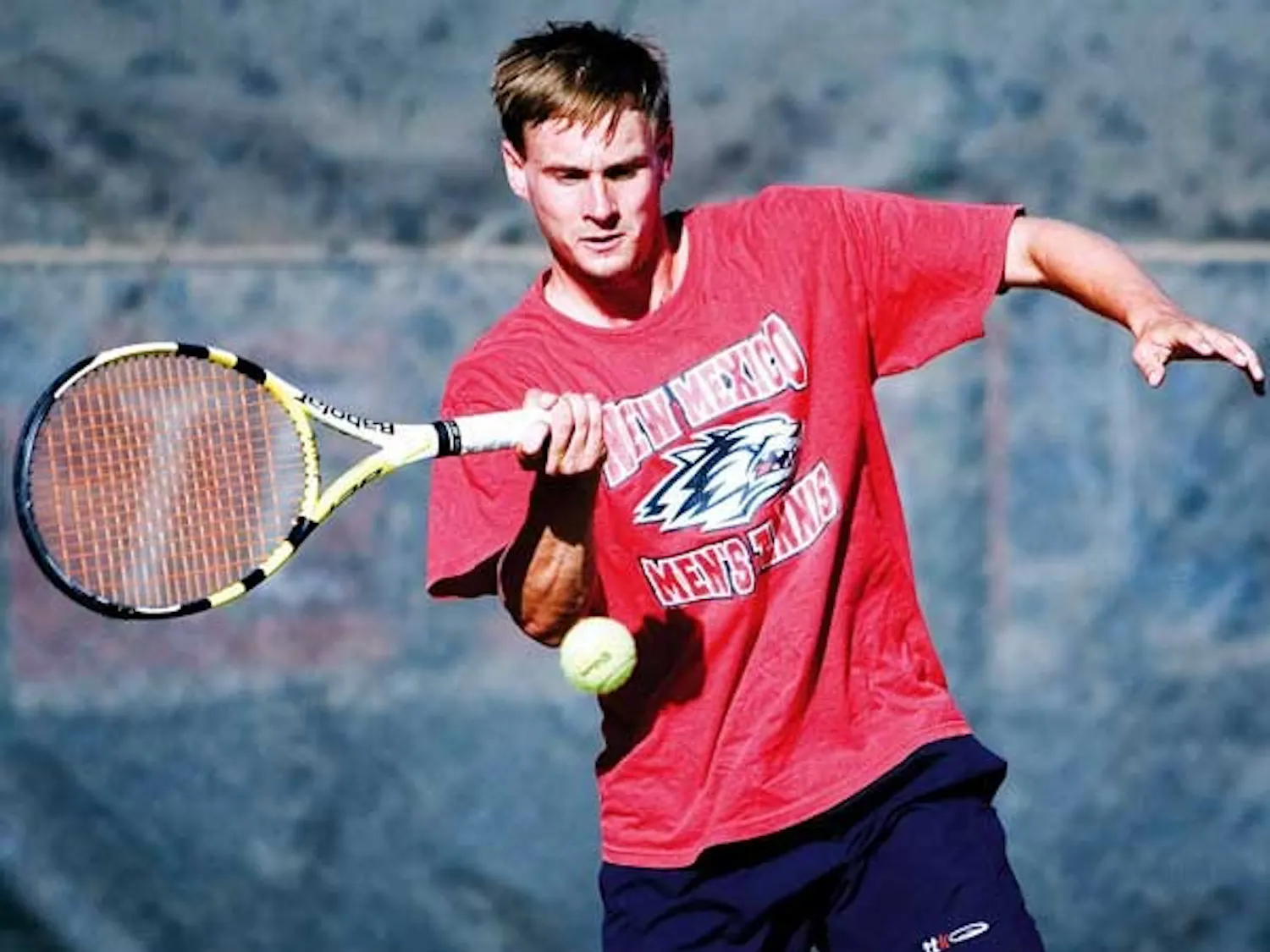 UNM's Joe Wood hits a forehand during practice Thursday at the UNM Tennis Complex.