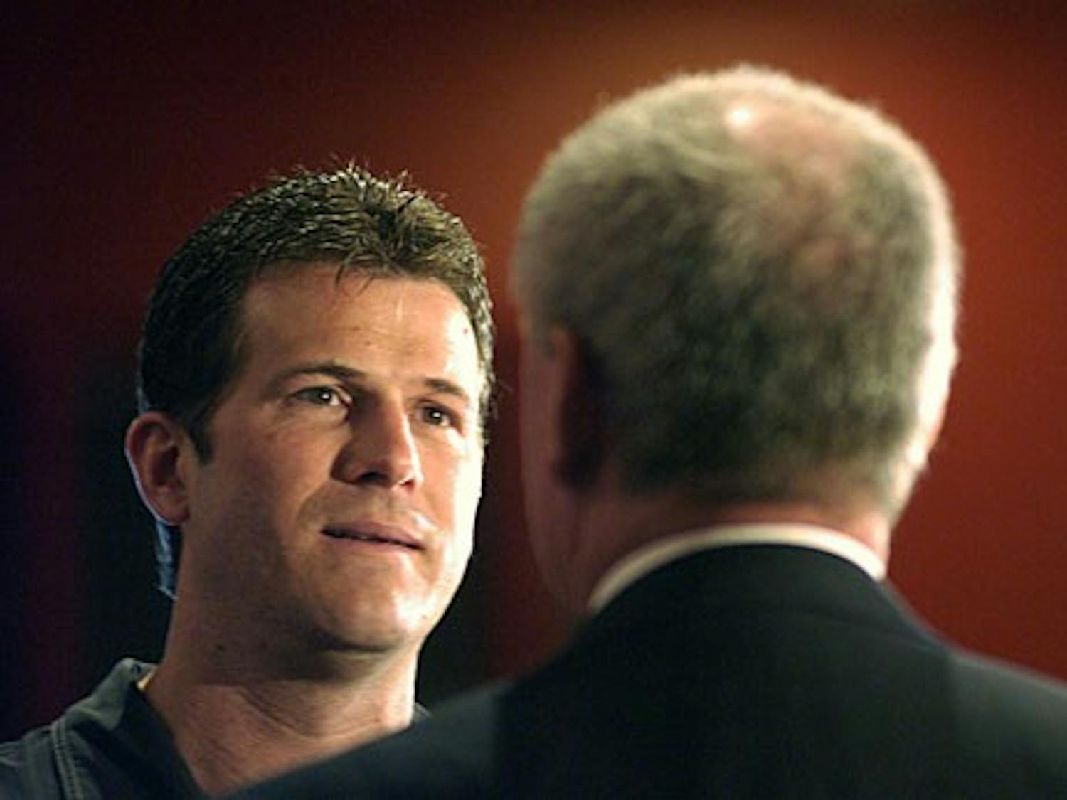 Men's basketball head coach Steve Alford speaks with Athletics Director Paul Krebs after a news conference Monday at the Davalos Center. Krebs announced that Alford signed a three-year extension, which will keep him at UNM through the 2015-16 season.