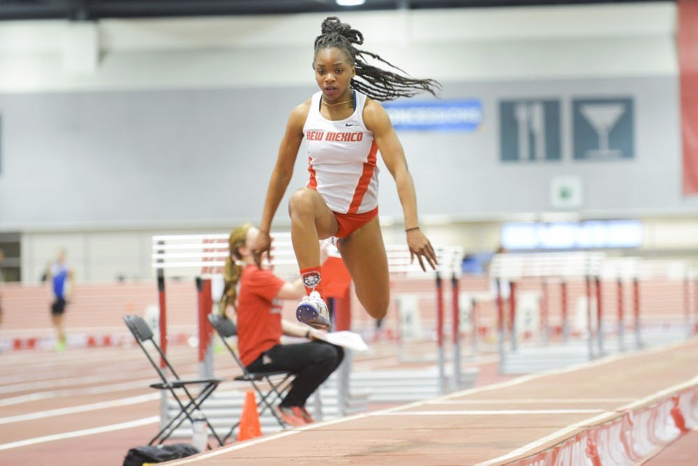 Junior jumper Jannell Hadnot leaps in the air before her last step into the sand pit Saturday, Jan. 23, 2016 at the Albuquerque Convention Center. The Lobos will compete in the New Mexico Classic and Multis this Saturday.