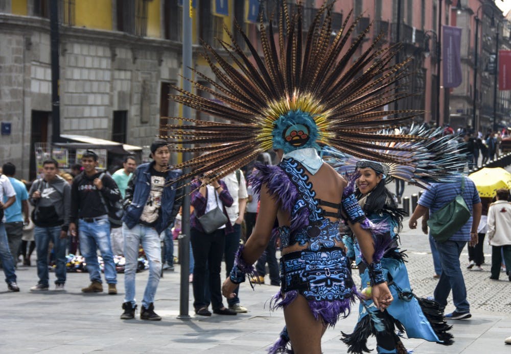 Traditional Aztec dance being performed for tourists and citizens in Mexico City July 8, 2018.