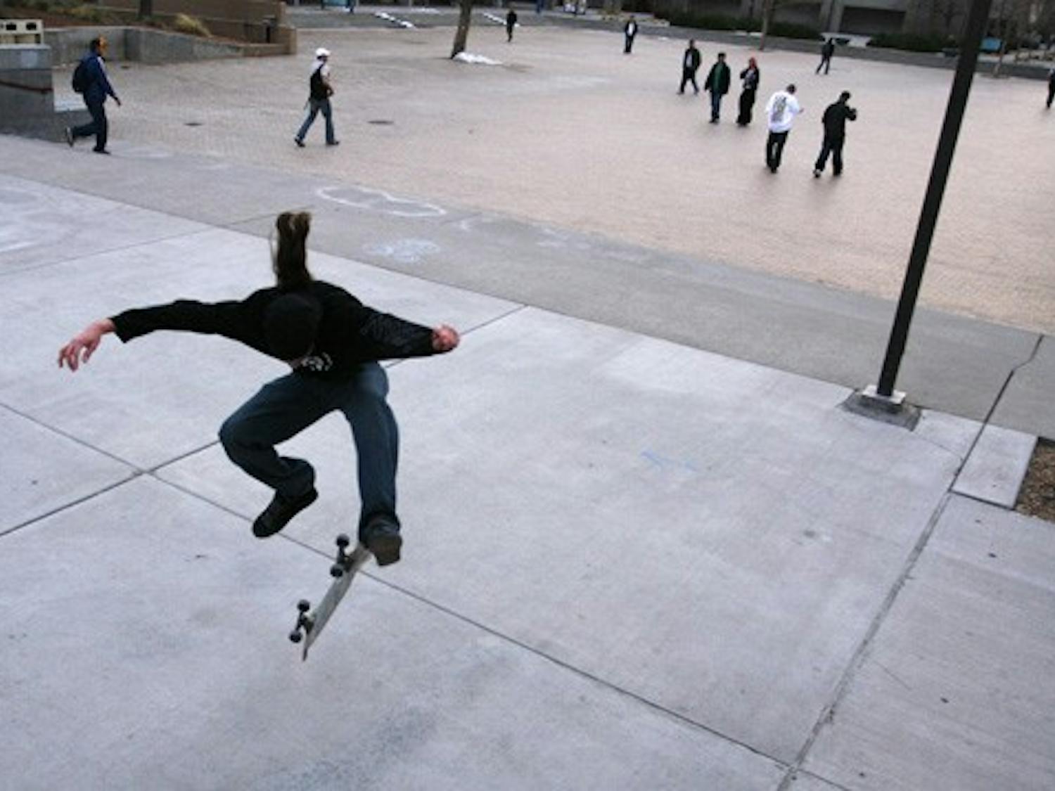Student Jackson Sabol skateboards outside the SUB on Monday. This weeks warm weather has brought many students outdoors.