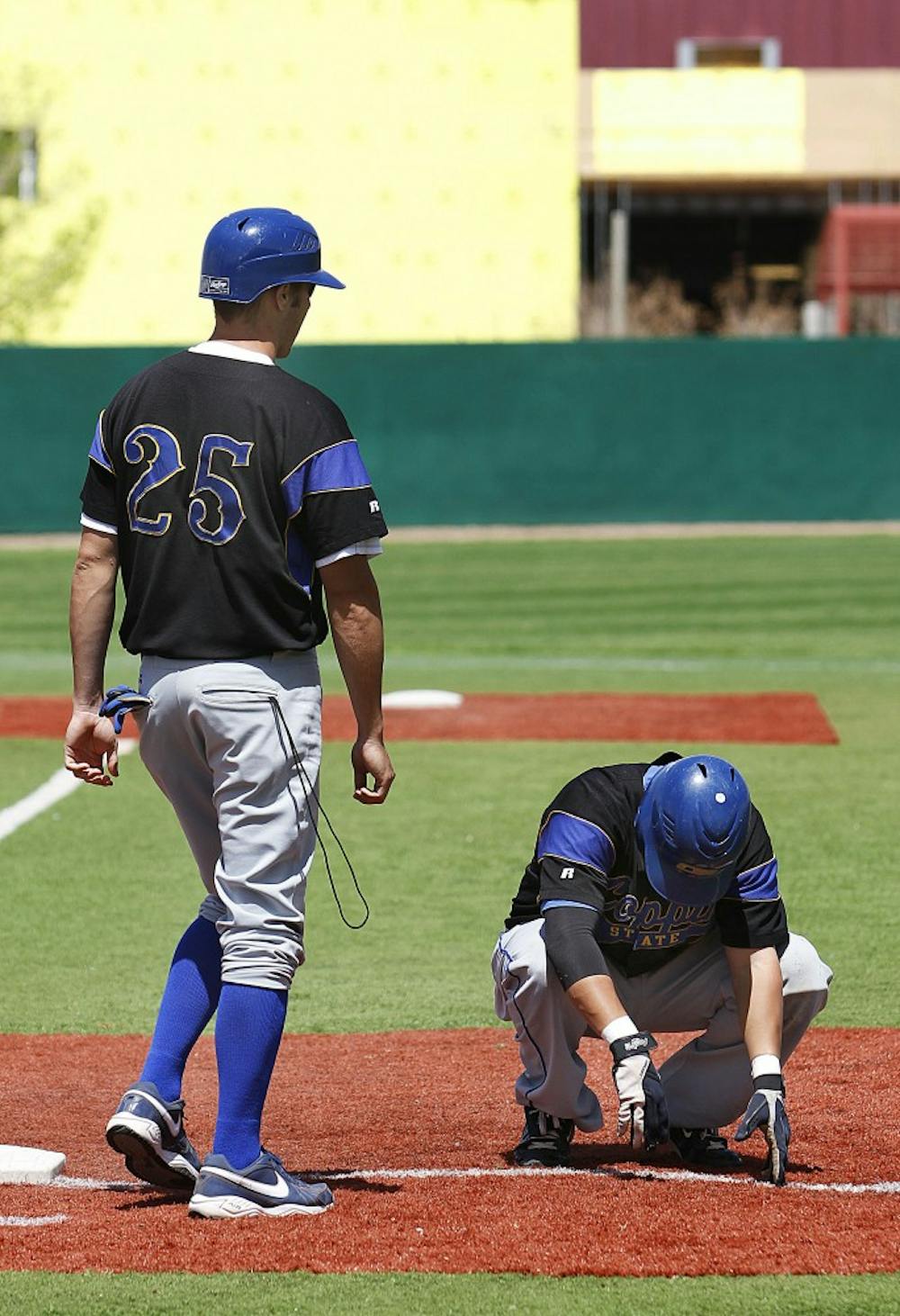 	Coppin State’s Dan Gleiberman crouches down after grounding out during Sunday’s 29-3 loss to UNM.