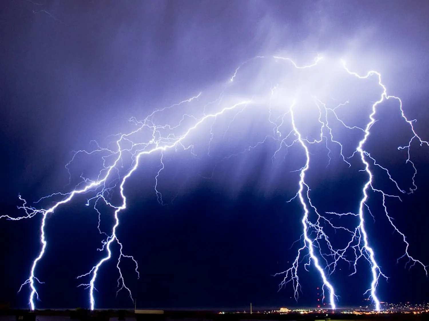 Lightning touches down over Northwest Albuquerque last summer.