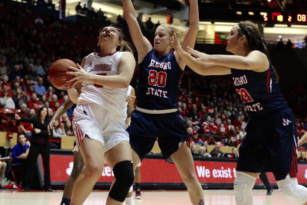 Junior forward Josie Greenwood is guarded by Fresno State's defense at WisePies Arena Saturday, Jan. 2, 2015. The Lobos lost to Utah State on Saturday&nbsp;72-56.&nbsp;