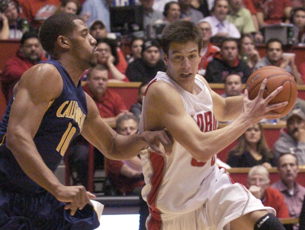	Roman Martinez drives past California forward Jamal Boykin on Dec. 2 at The Pit. The Lobos travel to face San Diego today, and a shot at cracking the top 25 could be on the line for UNM.