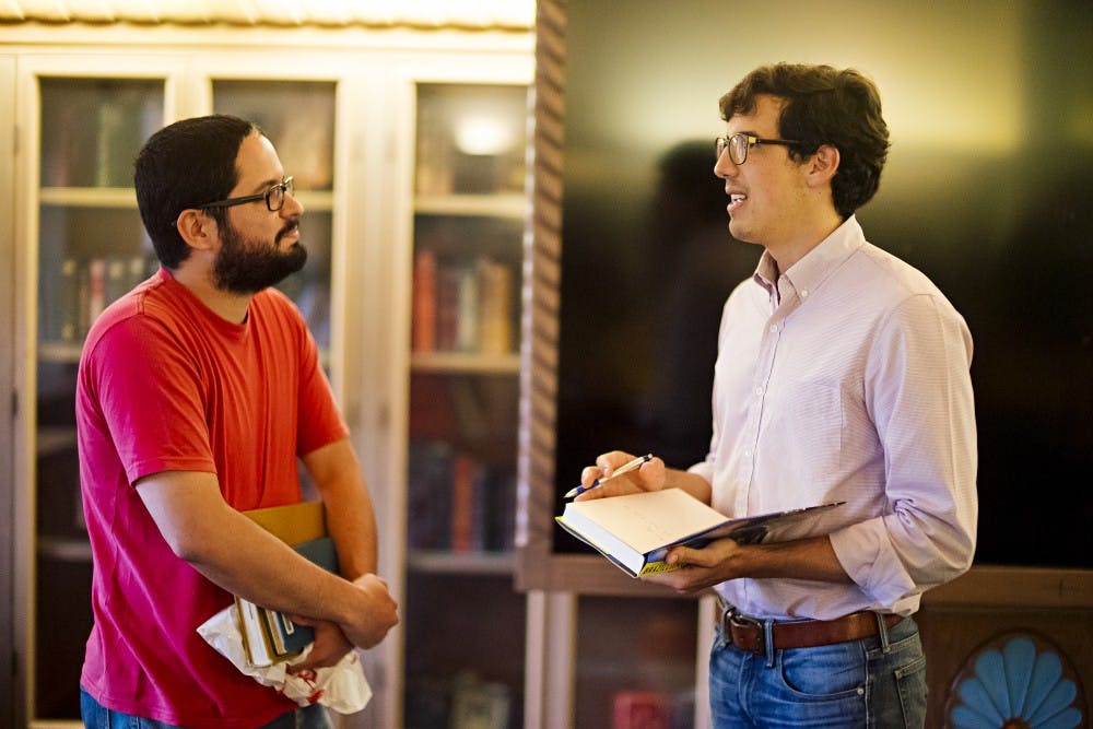 Journalist Alex Cuadros (right) speaks with Eduardo Lima (left0 at UNM Zimmerman Library in Willard Room on Tuesday September 6th 2016