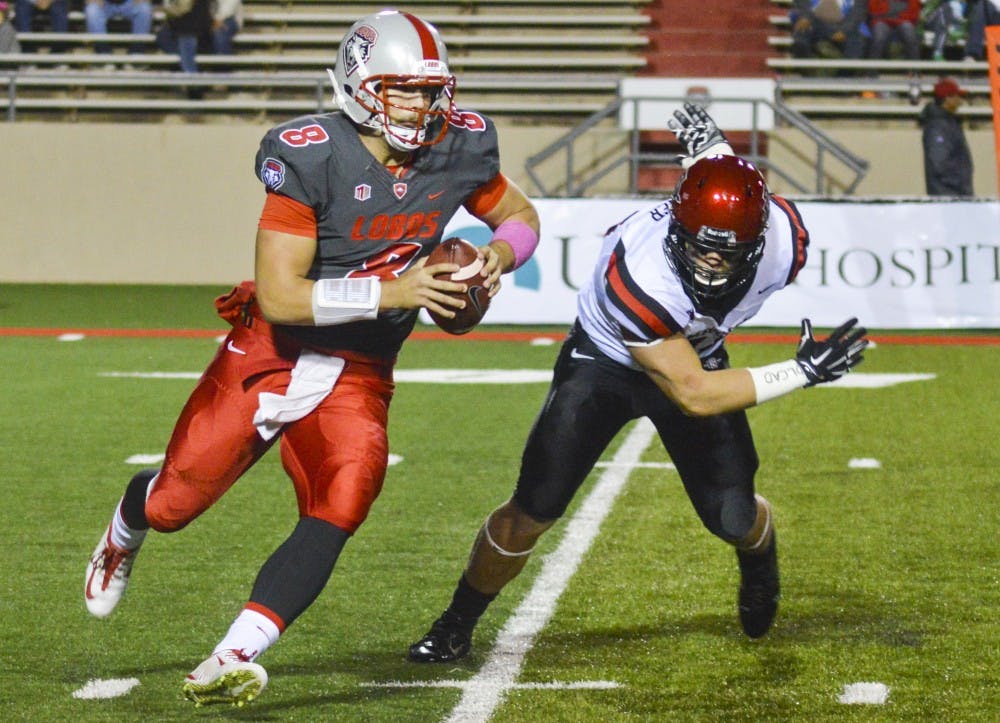 Lobo quarterback Cole Gautsche runs with the ball during the football game against the San Diego State Aztecs on Friday night.