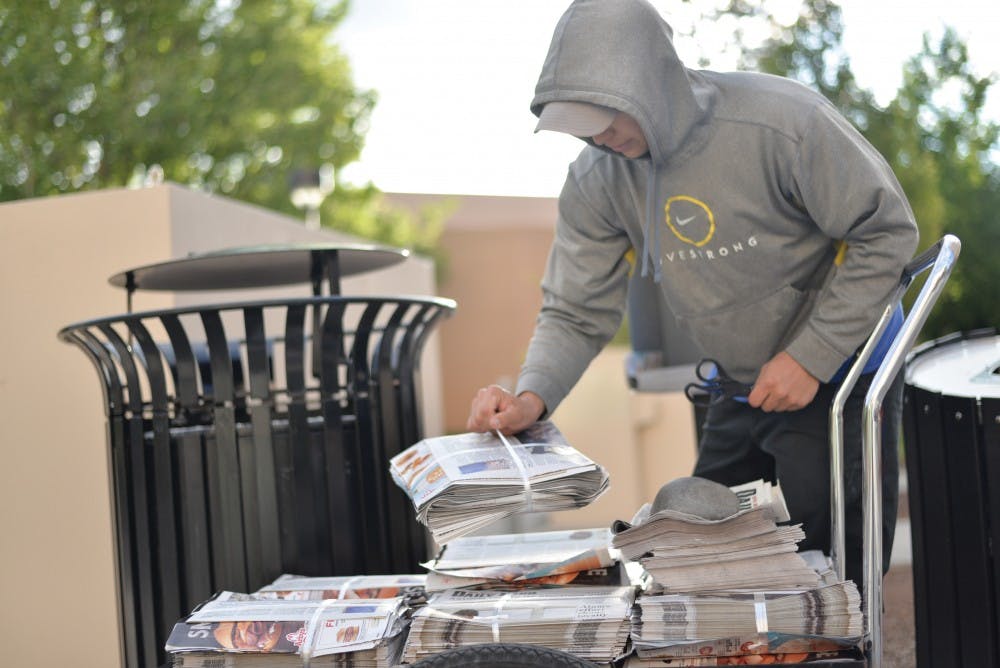 A newspaper carrier drops off copies of Daily Lobo around campus on April 25. The Daily Lobo will transition to a digital-first format beginning of the fall semester. 