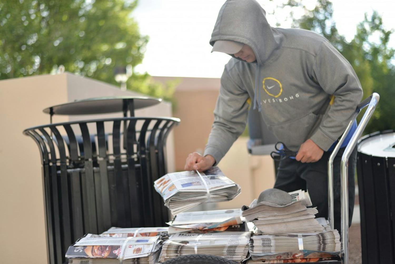 A newspaper carrier drops off copies of Daily Lobo around campus on April 25. The Daily Lobo will transition to a digital-first format beginning of the fall semester. 
