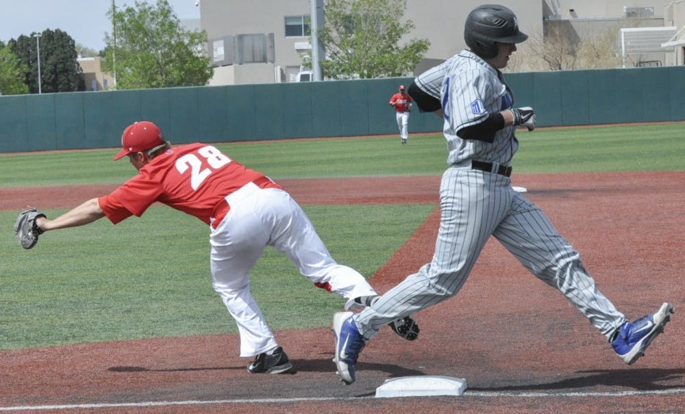 Sophomore first baseman Jack Zoellner attempts to tag a runner out at first base during the Lobos versus Air Force game Saturday afternoon. The Lobos went on to increase their lead to the final score of 5-0 in the seventh inning.

