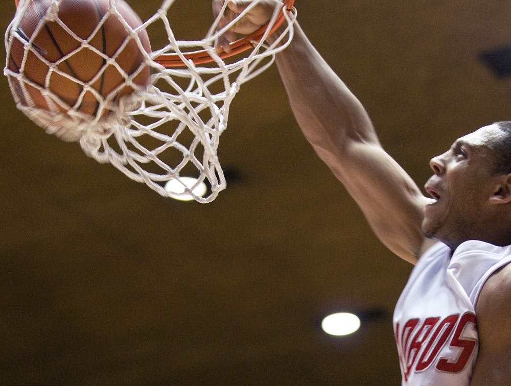 	Dairese Gary throws down a thunderous jam at the end of Saturday’s game against Colorado State. The Lobos prevailed, 82-64.