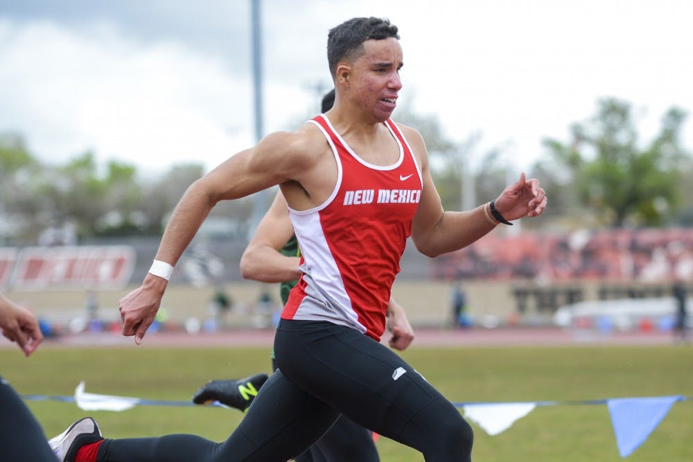 A Lobo track and field runner competes on a rainy day during the Don Kirby Tailwind Invitational Saturday, April 1, 2017 in Albuquerque, New Mexico. 