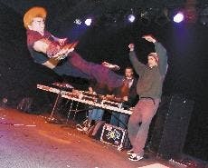 "Sugar" Shane Montoya, left, break-dances to musical group the Zoo at  the Launchpad on Thursday night.
