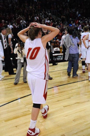 Amy Beggin walks off the Santa Ana Star floor after the Lobos were upended 78-69. Beggin had 15 points and three rebounds, but it  wasn't enough.