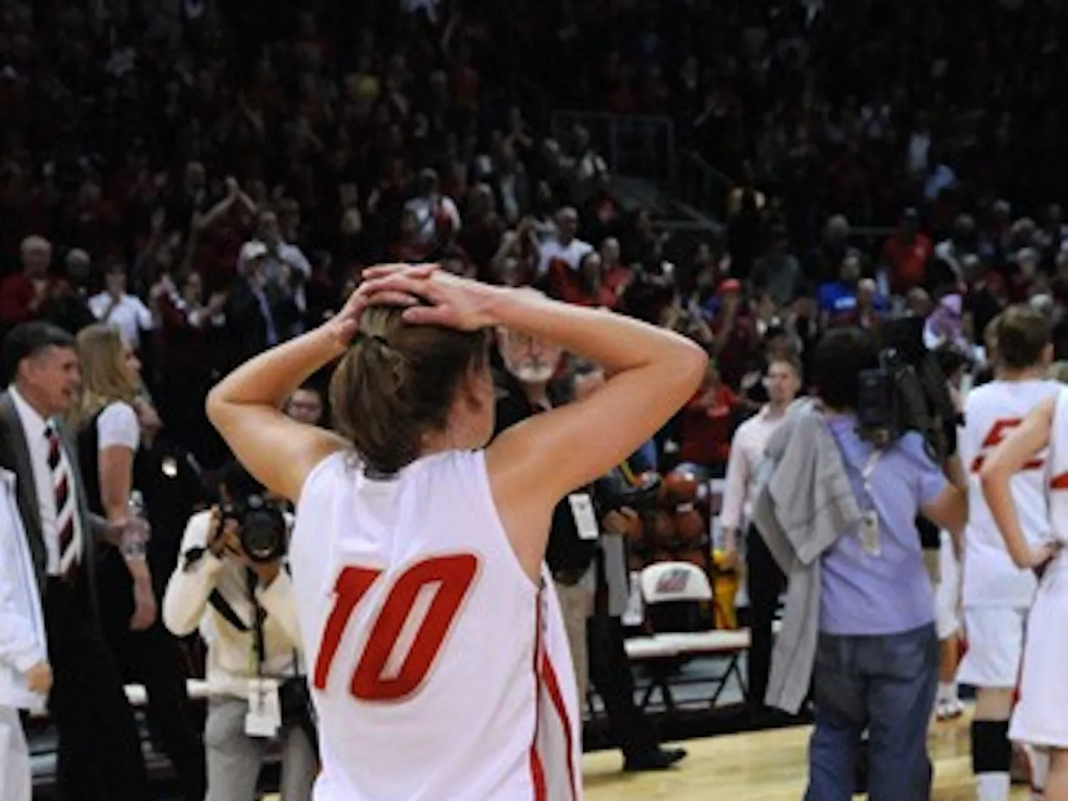 Amy Beggin walks off the Santa Ana Star floor after the Lobos were upended 78-69. Beggin had 15 points and three rebounds, but it wasn't enough.