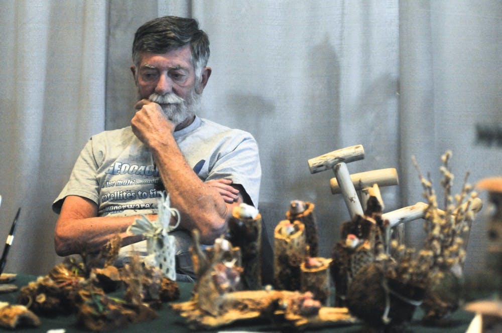 James Silva from East Mountain Wood waits for customers at the ASUMN Arts and Crafts Fair on Wednesday. The Arts and Crafts Fair will continue through Friday in the SUB Ballrooms.